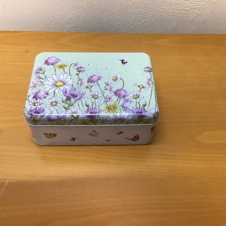 Metaldåse med blomstermotiv